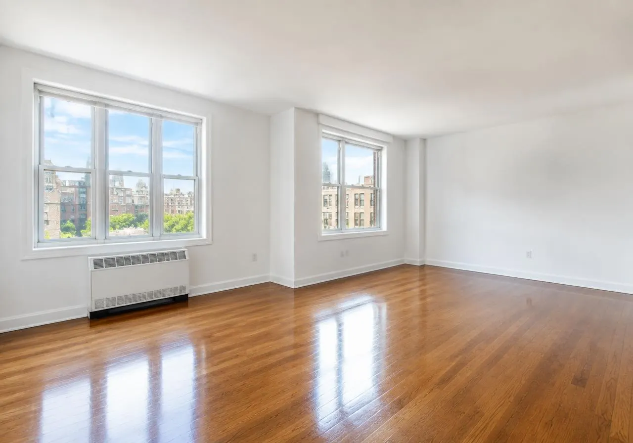 Empty, freshly cleaned room with polished wood floors